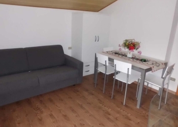 Apartment in San Giovanni di Fassa - Pozza. The flat is a mansard on the second floor composed of a bedroom, a bad with shower, kitchen/sitting-room with a double bed-sofa and TV, a balcony, washing mashine and car park.