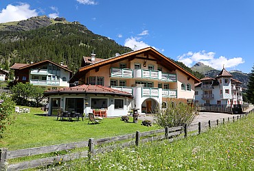 Apartment in Mazzin - fraz. Campestrin. Villa Marta is located in a central panoramic position, is all fenced and has ample parking and a beautiful garden. It is 50 mt. far of the ski-bus stop, is close to the bar and, at 150 mt. there is the cross country track (Marcialonga), the playground, the departure of the walks, the bicycle and fitness trail. Campestrin is part of the municipality of Mazzin, is located 2 Km. from Campitello di Fassa and 4 Km. from Canazei, known ski resort where the lift leave for the tour of the 4 steps (Sella-Ronda). Our apartments have been awarded by  APT Fassa with 3 or 4 GENTIANS and with which it ensures on the site: www.fassa.com all the services that are included.  We have too Internet-connection in each apartment.
Inside of the stair there is a lockable ski rack, the rack boots, the ski boot warmer, iron and ironing board available to everyone. .Since We are associated with Fassappartamenti and with Fassa APT, we give our guests, in the summer, the 