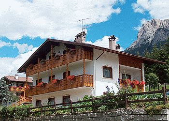 Apartment in Soraga di Fassa. Our House is situated in a very quiet, panoramic and sunny position in Soraga. We own three confortable and completely finished apartments.
Two of them allow a stay 2/3 people and measure 35-40 mq. They have 1 bedroom, living-room with sofa beds, kitchenette with all the kitchen-tools, bathroom.
The third is a 4/5 beds apartment and measures almost 75 mq. It has two bedrooms with two single beds (or a 1 double bed), a living-room with a sofa bed, kitchen with all the kitchen-tools, a bathroom.
For our guest there is also warm depository where they can leave their ski shoes. In front of the house there is a private parking.