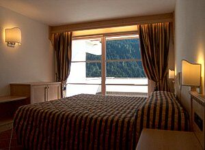 Residence a San Giovanni di Fassa - Pozza. La camera da letto