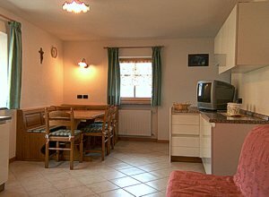 Apartment in San Giovanni di Fassa - Muncion. The apartments have 2 bed-rooms, living room with kitchen and bed-settee, bathroom with dish-washer, TV.