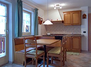 Apartment in San Giovanni di Fassa - Muncion. The apartments have 3 bed-rooms, living room with kitchen and bed-settee, 2 bathrooms with dish-washer, TV.