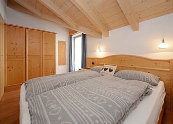 Residences in Campitello di Fassa. One double beds room, bathroom and kitchen/living-room compose the apartment type C.