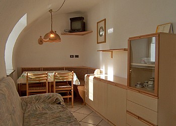 Apartment in Soraga. Ground floor apartment, 55 square meters, consists of two bedrooms, two bathrooms, small living room with kitchenette. Of easy access, presents the type vaulted ceilings, characteristic of the ancient buildings of the Val di Fassa.