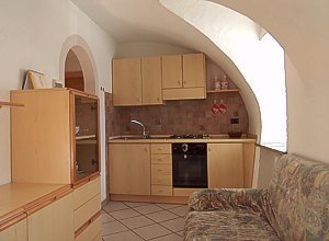 Apartment in Soraga. The kitchen is endowed with an electric oven, a gas-stove, a refrigerator, a wash-basin, besides a traditional kitchen-equipment