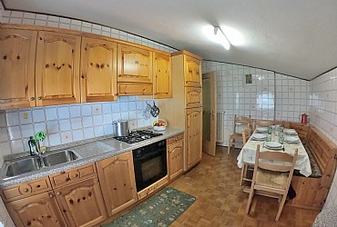 Apartment in Canazei. Large and cozy kitchen, separated from the living room, with dishwasher.