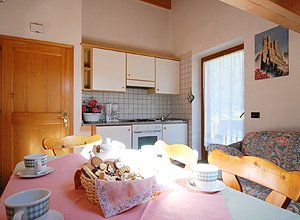 Apartment in San Giovanni di Fassa - Vigo. The mansard consists of one double bedroom, bathroom with shower or bath and hair dryer, dining room with table, sofa bed and satellite tv. The kitchenette 
is equipped with electric oven and an american coffee maker.
Max. number people: 4