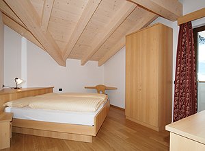 Apartment in Soraga di Fassa. Other bed-room with a bed in angular displacement. Warm duvet on the beds.
