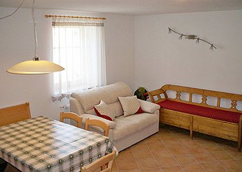 Apartment in Moena. Living room with a sofa on the right that was part of my grandmother's original forniture.