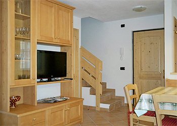 Apartment in Moena. Living room with 32