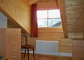 Apartment in Moena. Bedroom located in the mansard with sofa bed (two places).