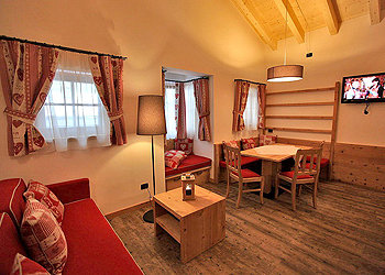 Apartment in Canazei. The apartment is furnished in typical mountain style.