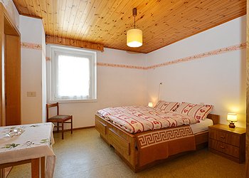 Apartment in Canazei. 1st. Bedroom with doublebed and bathroom