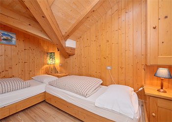 Apartment in Canazei. Room with two single beds. 
Velux Window.