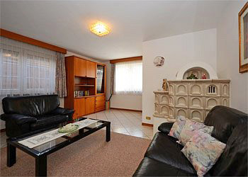 Apartment in Moena. The apartment is provided with:
- independent entrace;
- living room with Viennese majolica wood stove (we operate it for you), colour satellite TV set with video recorder (reception of foreign channels)
- fully equipped kitchen with dishwasher, fridge and freezer, electric oven, microwave oven, other small electrical appliances and safe;
- 1 bedroom with a double bed and a wooden cot;
- 1 bedroom with twin beds (not a bunk bed);
- 1 bathroom with tub/shower; phon.