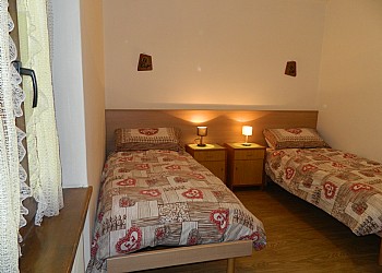 Apartment in Canazei. small room with two single beds