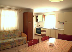 Residences in Campitello di Fassa. This is the kitchencorner of the apartment nr. 2 with dishwascher, over and microover, big fridge with freezer.