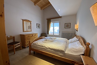 Appartamento a Moena. Camera da letto con matrimoniale e letto singolo.