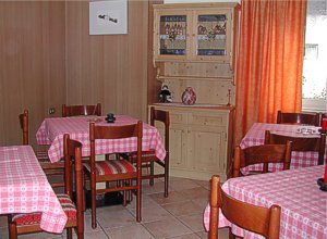 Apartment in Moena. On the ground-floor a big dining room for 20 people and next to it, the living room with TV-sat