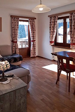 Apartment in Canazei. livinroom whit sofa and tv
