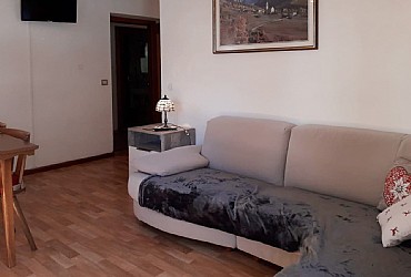 Apartment in Canazei. livingroom with sofa and tv