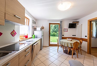 Appartamento a Canazei. Ingresso e angolo cottura appartamento tipo