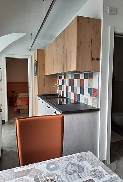 Apartment in Soraga di Fassa. Ground floor apartment, 55 square meters, consists of two bedrooms, two bathrooms, small living room with kitchenette. Of easy access, presents the type vaulted ceilings, characteristic of the ancient buildings of the Val di Fassa.

The kitchen is endowed with an electric oven, a gas-stove, a refrigerator, a wash-basin, besides a traditional kitchen-equipment.
