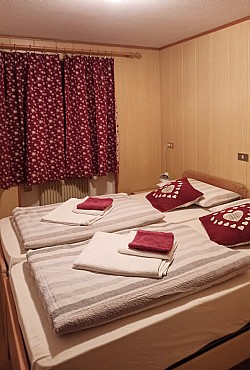 Apartment in San Giovanni di Fassa - Pozza. Bedroom with double beds.